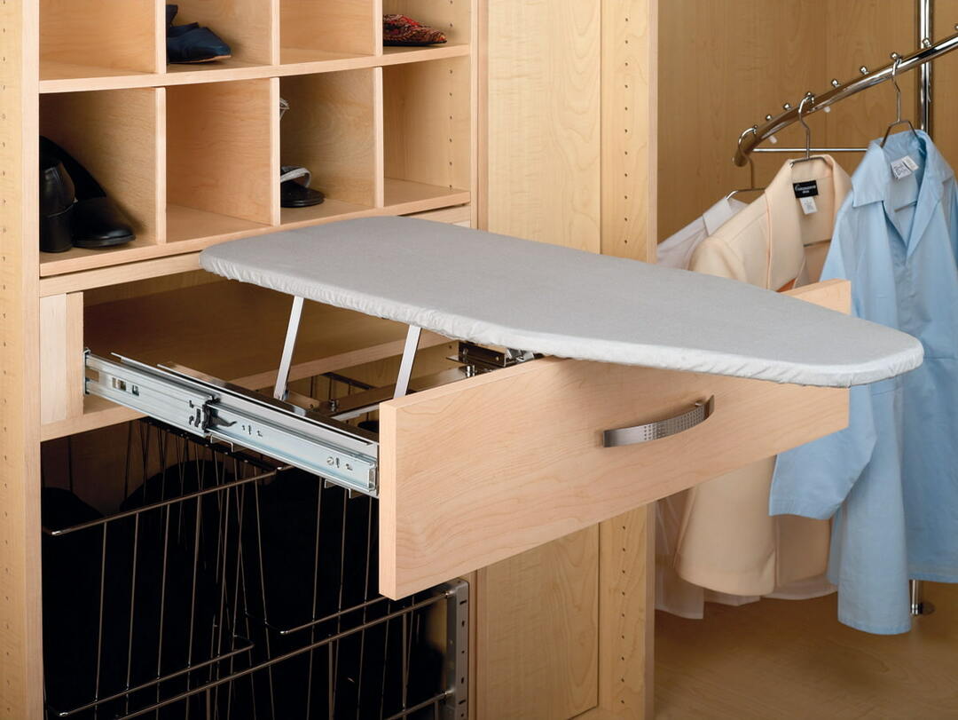 Pull-out ironing board in a compartment-type wardrobe