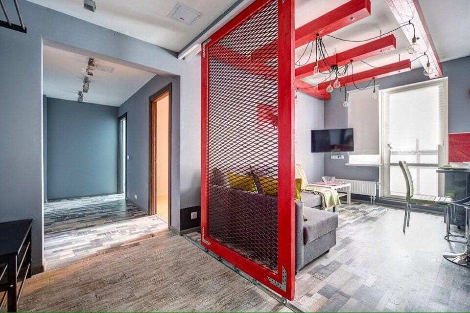 Red sliding partition in a loft interior