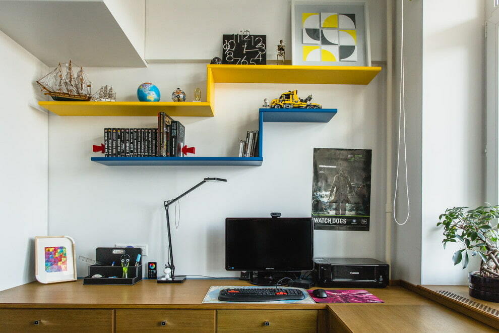 Multi-colored open shelves in a teenager's room