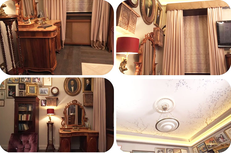 De kamer wordt verlicht door een antieke lamp met een matglazen kap, versierd met een gouden rand rond de omtrek.