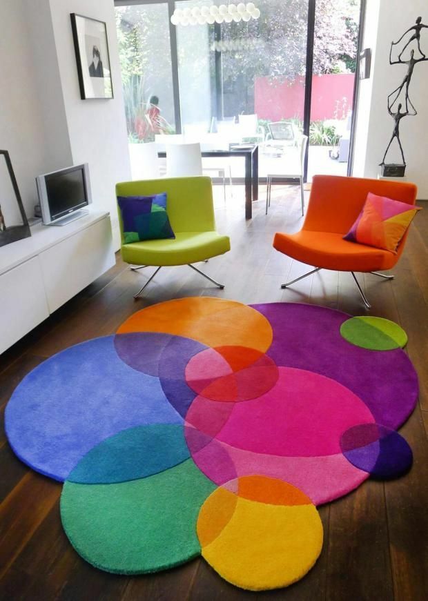 Bright colors of the carpet in the room of a country house