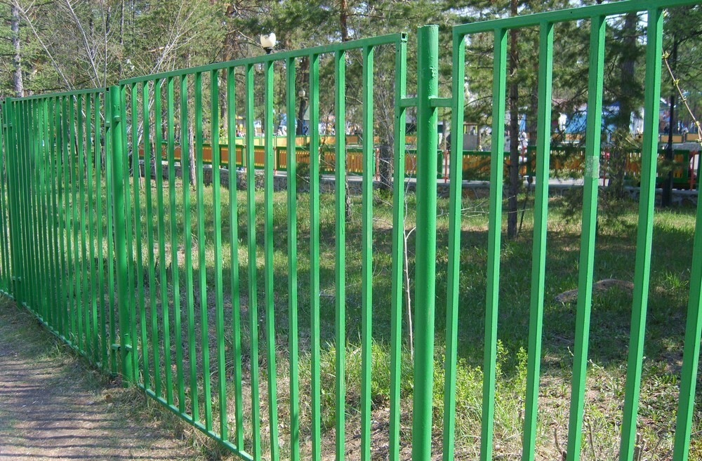 Welded fence made of green metal