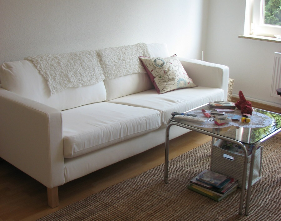 White sofa with textile upholstery