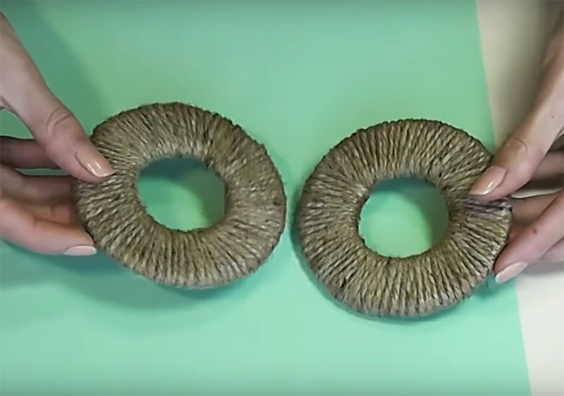 Wrap these rings with jute rope, securing it with hot glue.