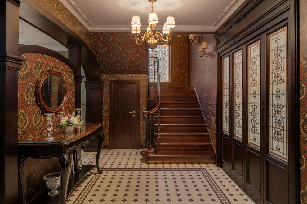 Dark wallpaper in a large hallway of a private house