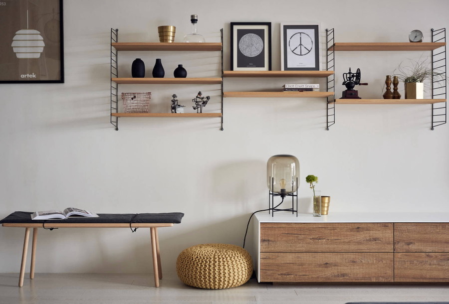 Shelving the wall of the living room in scandi style