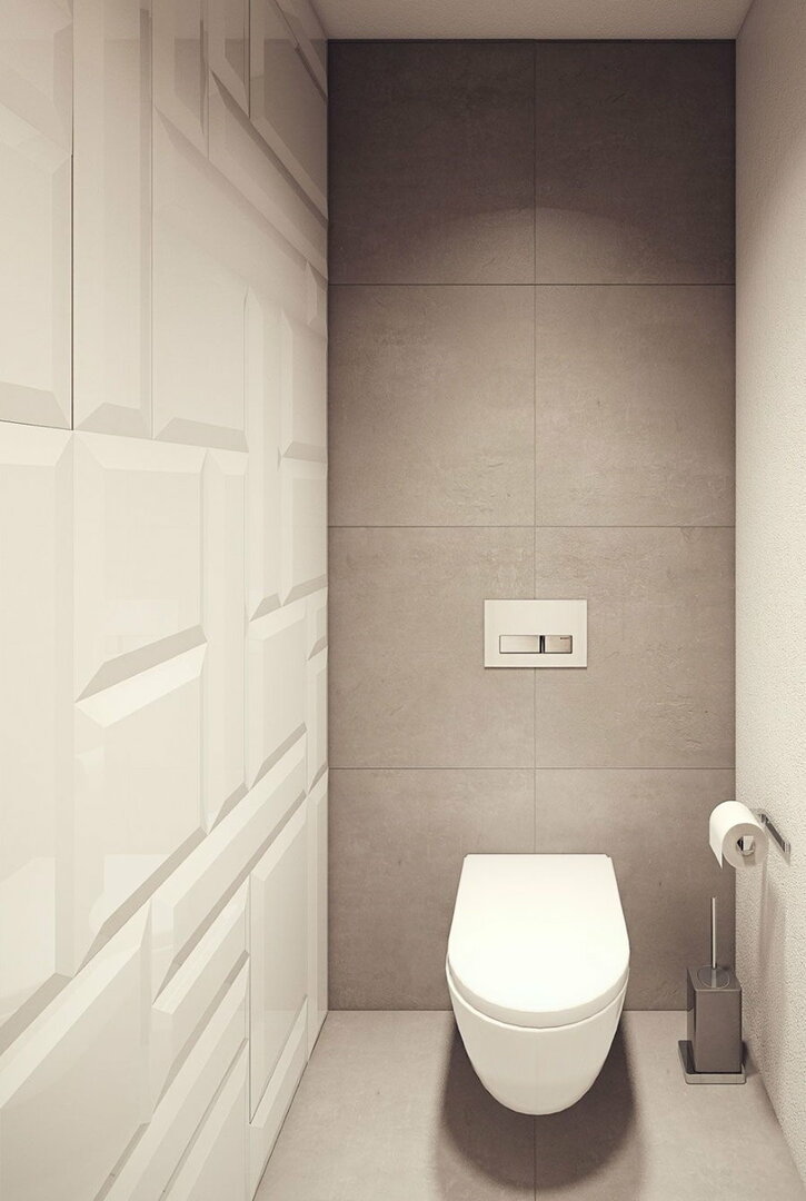 Vit vägghängd toalett i en modern toalett