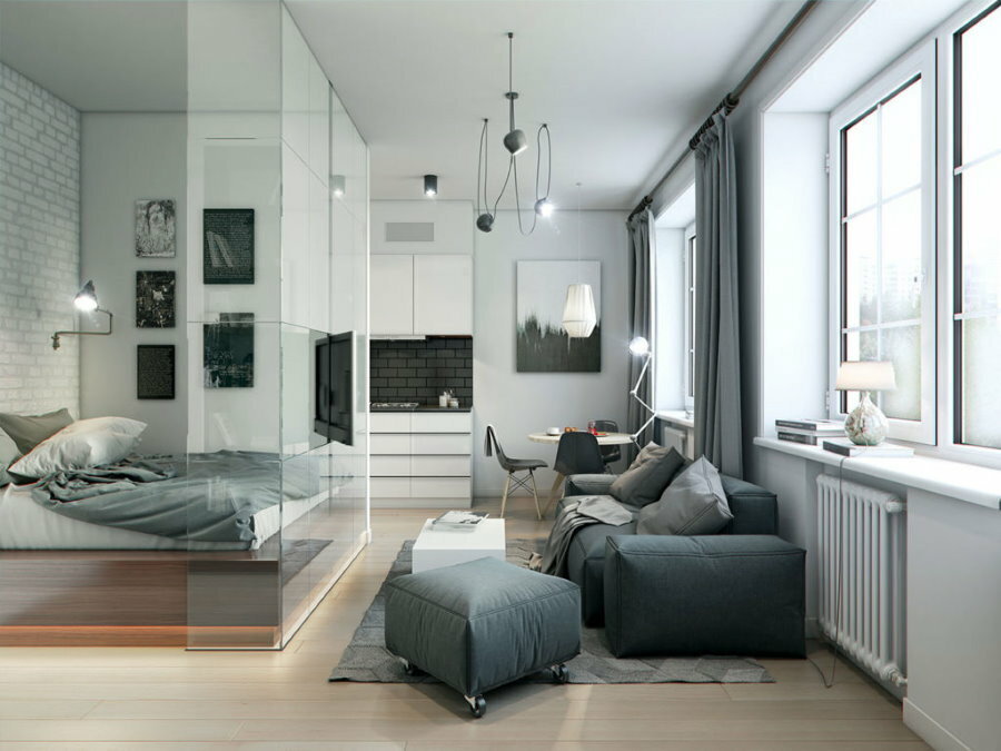 Área de dormir detrás de una mampara de vidrio en una habitación individual