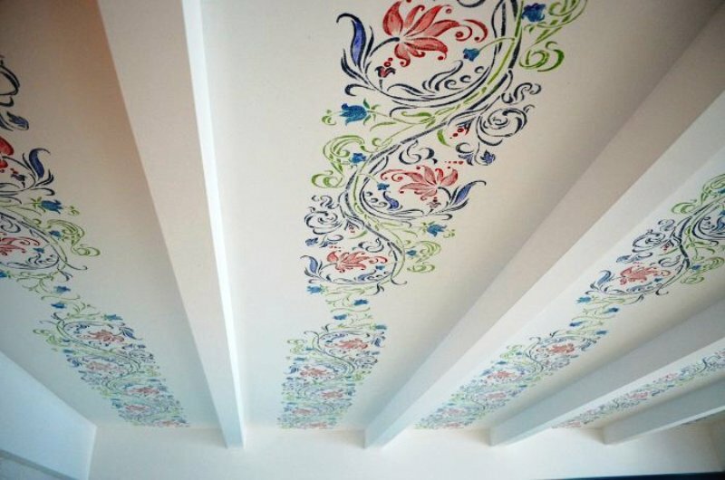 stencil painting of the ceiling in the nursery