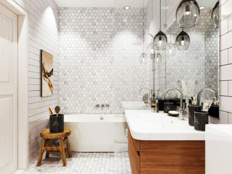 Banyo, ters renkli cam şarap kadehleri ​​ve tavan spotları şeklindeki tasarım lambalarla aydınlatılıyor.