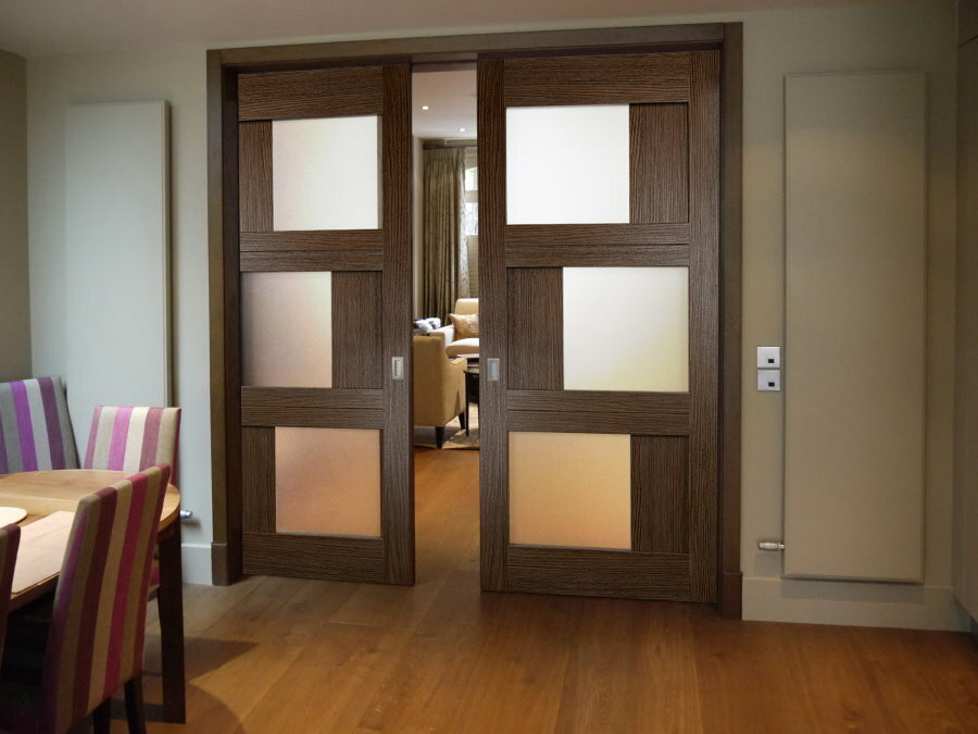 Sliding doors made of MDF with glass inserts
