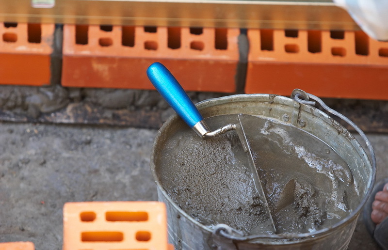 Cement mortar in a galvanized bucket
