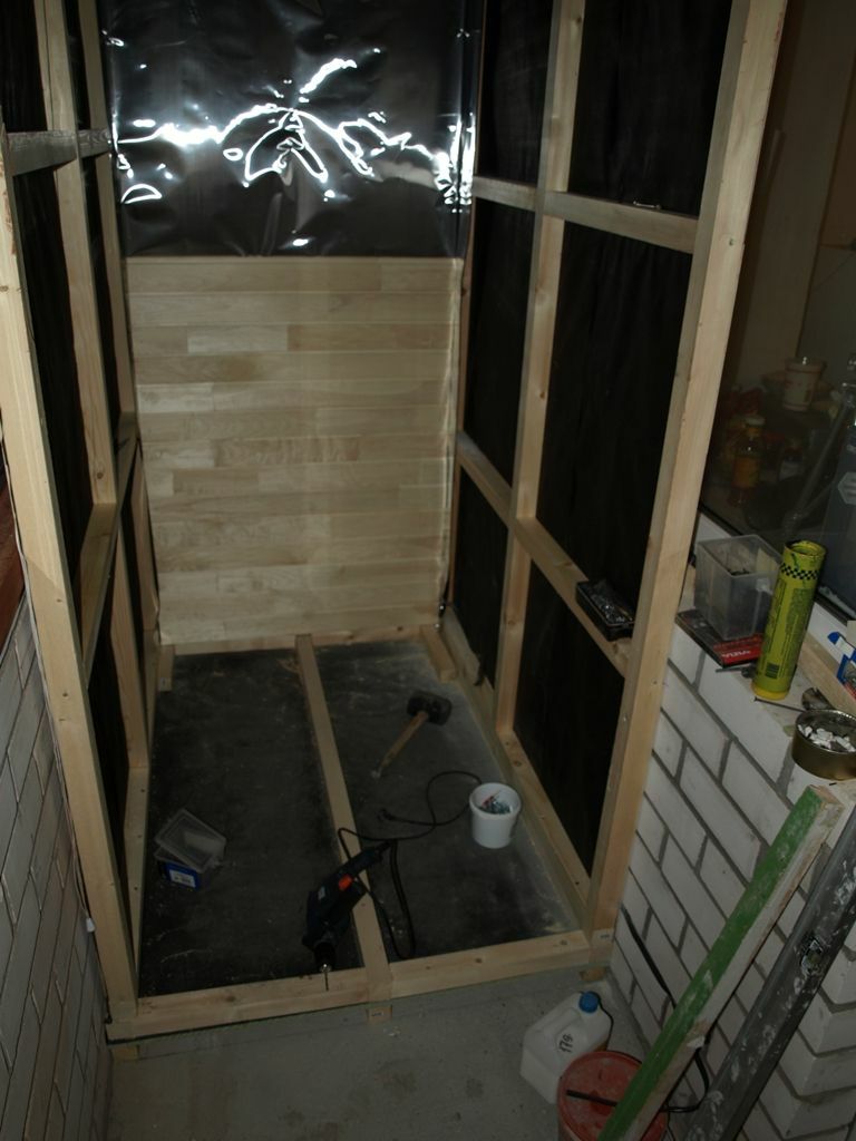 Construction of the wall frame for the sauna on the balcony