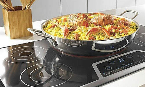 What distinguishes the induction hob from the electric
