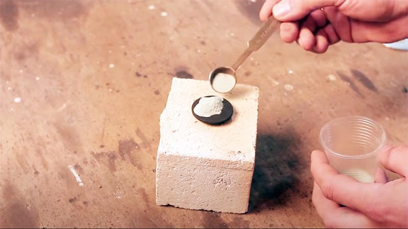 The powder is poured onto a graphite disk, you can try to warm it up