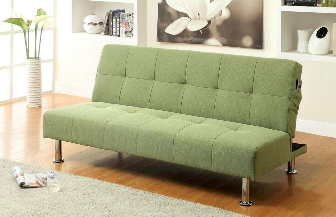 Pull-out sofa upholstered in green
