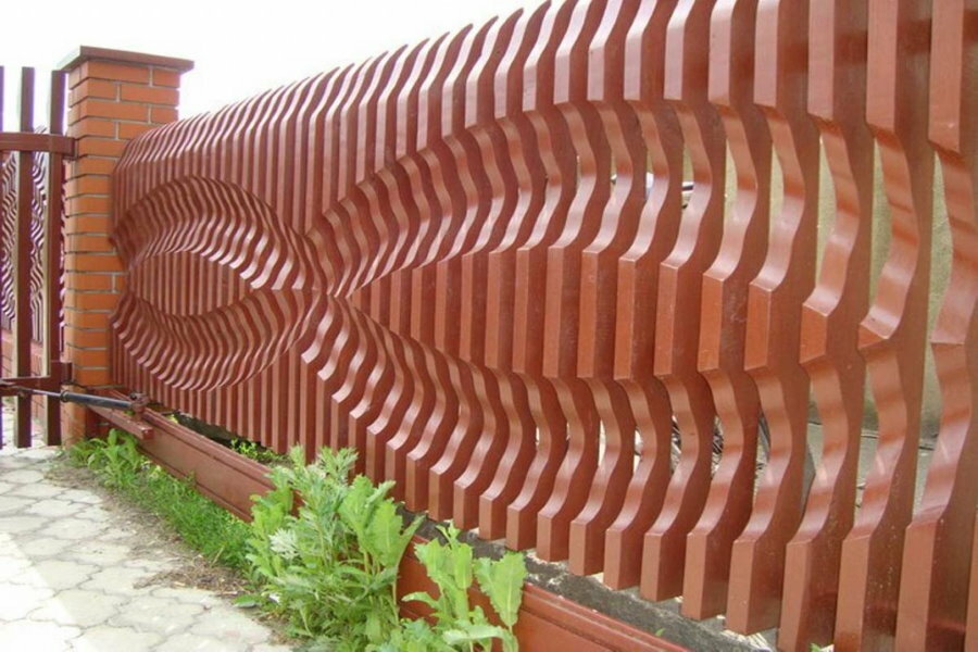 Designer fence made of wooden boards